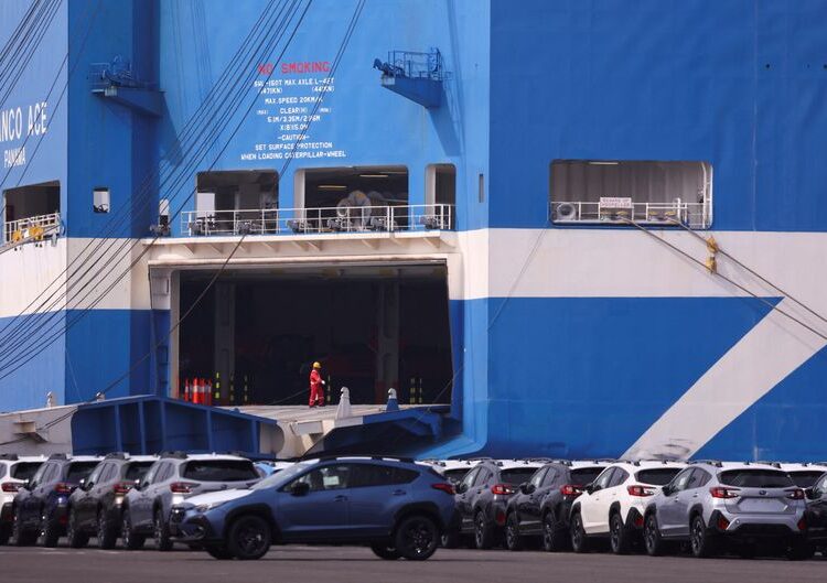 FILE PHOTO: Newly manufactured cars awaiting export are parked at a port in Yokohama, south of Tokyo, Japan March 27, 2025. REUTERS/Issei Kato/File Photo
