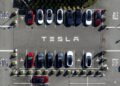 FILE - Tesla vehicles line a parking lot at the company's Fremont, Calif., factory, on Sept. 18, 2023. (AP Photo/Noah Berger, File)