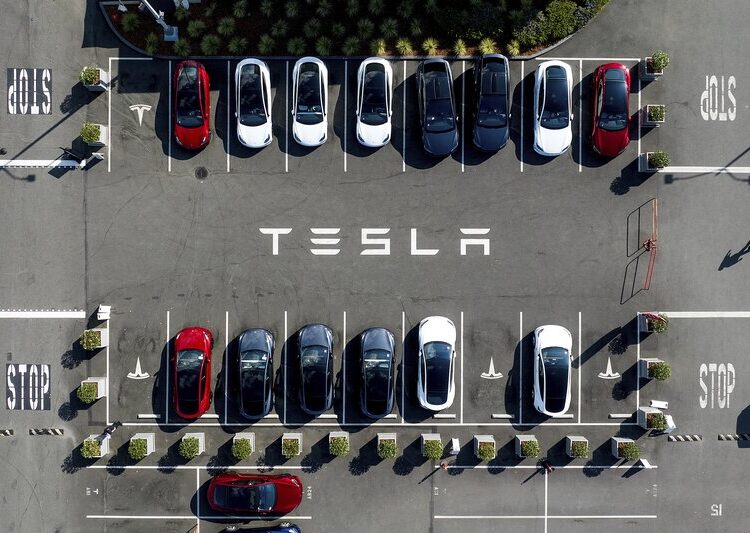 FILE - Tesla vehicles line a parking lot at the company's Fremont, Calif., factory, on Sept. 18, 2023. (AP Photo/Noah Berger, File)