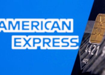 FILE PHOTO: Credit card is seen in front of displayed American Express logo in this illustration taken, July 15, 2021. REUTERS/Dado Ruvic/Illustration/File Photo