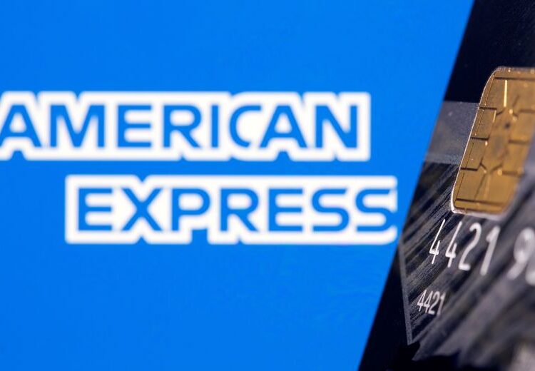 FILE PHOTO: Credit card is seen in front of displayed American Express logo in this illustration taken, July 15, 2021. REUTERS/Dado Ruvic/Illustration/File Photo
