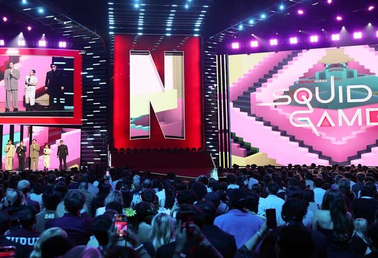 INGLEWOOD, CALIFORNIA - MAY 31: (L-R) Lee Jung-jae, Lee Byung-hun, Park Sung-hoon, Kang Ae-shim, and Choi Seung-hyun speak onstage during NETFLIX TUDUM 2025: THE LIVE EVENT at The Kia Forum on May 31, 2025 in Inglewood, California. (Photo by Kevin Mazur/Getty Images for Netflix)