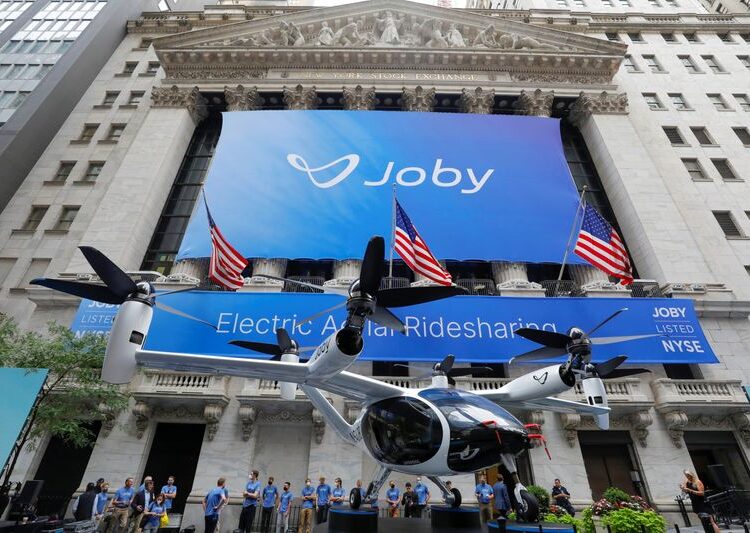 FILE PHOTO: The Joby Aviation Air Taxi is seen outside the New York Stock Exchange (NYSE) in Manhattan, New York City, U.S., August 11, 2021. REUTERS/Andrew Kelly/File Photo