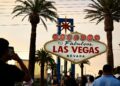 People take pictures with the Welcome To Fabulous Las Vegas sign under hazy orange skies as the sun sets in Las Vegas, Nevada on July 29, 2023. The National Weather Service said Saturday that the York Fire burning in the Mojave National Preserve is sending smoke into the Las Vegas Valley. (Photo by Patrick T. Fallon / AFP) (Photo by PATRICK T. FALLON/AFP via Getty Images)