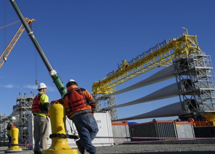FILE - A generator and its blades are prepared for transport to the open ocean for the South Fork Wind farm in New London, Conn., Dec. 4, 2023. (AP Photo/Seth Wenig, File)