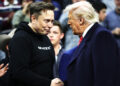 PHILADELPHIA, PENNSYLVANIA - MARCH 22: President Donald Trump and White House Senior Advisor, Tesla and SpaceX CEO Elon Musk shake hands while attending the NCAA Division I Wrestling Championship on March 22, 2025 in Philadelphia, Pennsylvania.  Trump last attended the NCAA wrestling championship in 2023 and has attended high-level sporting events since becoming president in January. (Photo by Kayla Bartkowski/Getty Images)