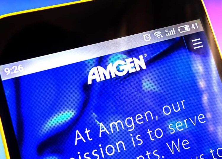 (madamF/Shutterstock.com)
stock-amgen-05-shutter
Berdyansk, Ukraine - March 30, 2019: Amgen website homepage. Amgen logo visible on the phone screen, Illustrative Editorial.
