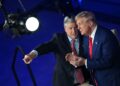 Former US President and Republican presidential candidate Donald Trump (R) chats with Fox News broadcaster Sean Hannity following a town hall at the New Holland Arena in Harrisburg, Pennsylvania, on September 4, 2024. (Photo by Mandel NGAN / AFP)
